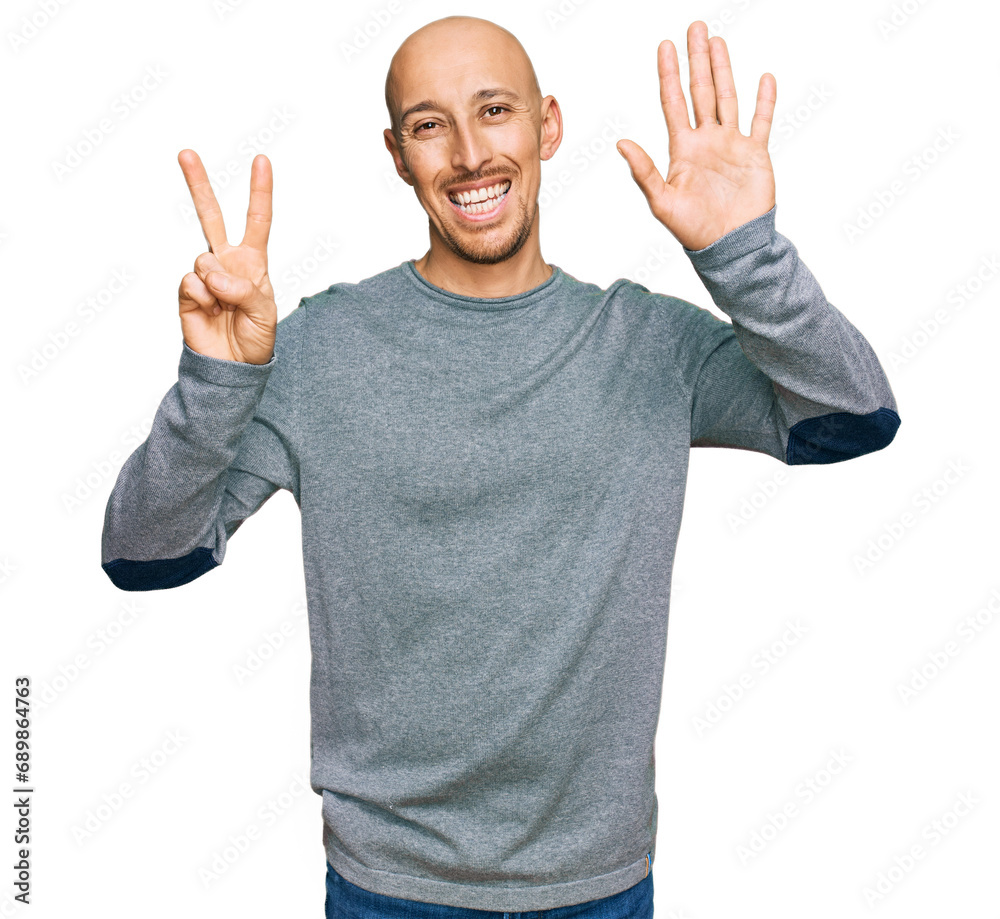 Bald man with beard wearing casual clothes showing and pointing up with fingers number seven while smiling confident and happy. Bald man with beard wearing casual clothes showing and pointing up with fingers number seven while smiling confident and happy.