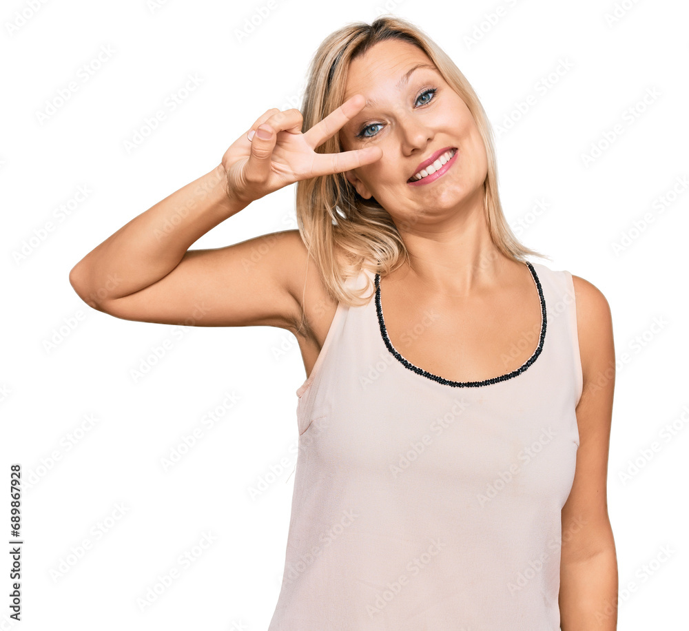 Middle age caucasian woman wearing casual clothes doing peace symbol with fingers over face, smiling cheerful showing victory Middle age caucasian woman wearing casual clothes doing peace symbol with fingers over face, smiling cheerful showing victory