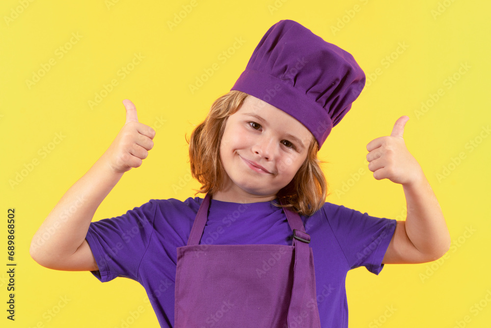 Kid chef cook, studio portrait. Children cooking. Kid boy with apron and chef hat. Kid chef cook, studio portrait. Children cooking. Kid boy with apron and chef hat.