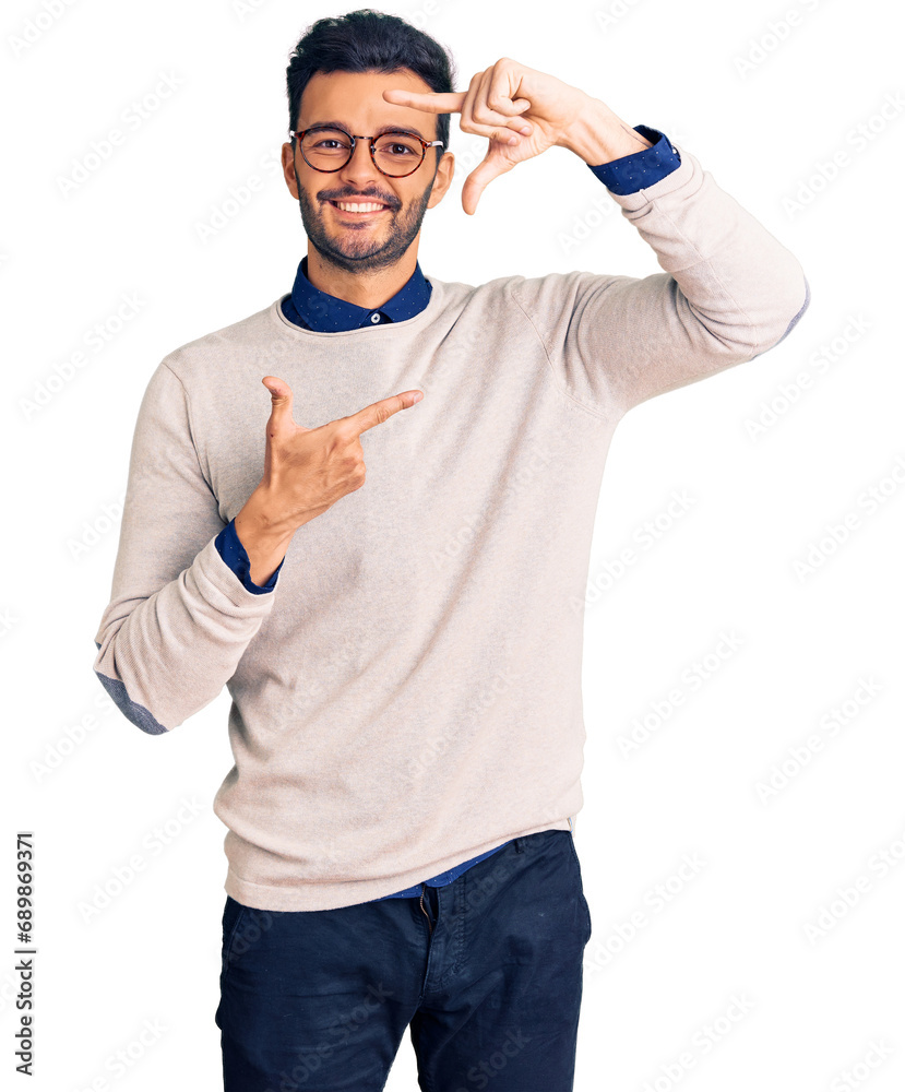 Young handsome hispanic man wearing elegant clothes and glasses smiling making frame with hands and fingers with happy face. creativity and photography concept. Young handsome hispanic man wearing elegant clothes and glasses smiling making frame with hands and fingers with happy face. creativity and photography concept.