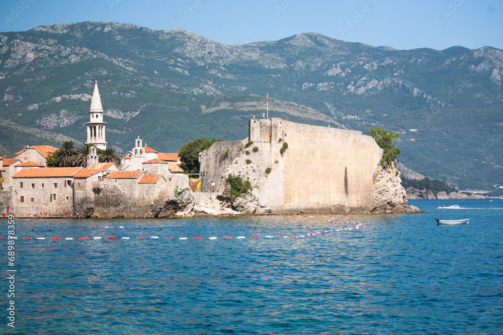 Seascape with the old town of Budva against the backdrop of mountains from the Adriatic Sea, Montenegro, for publication, poster, calendar, banner, cover, post, website. High quality photo