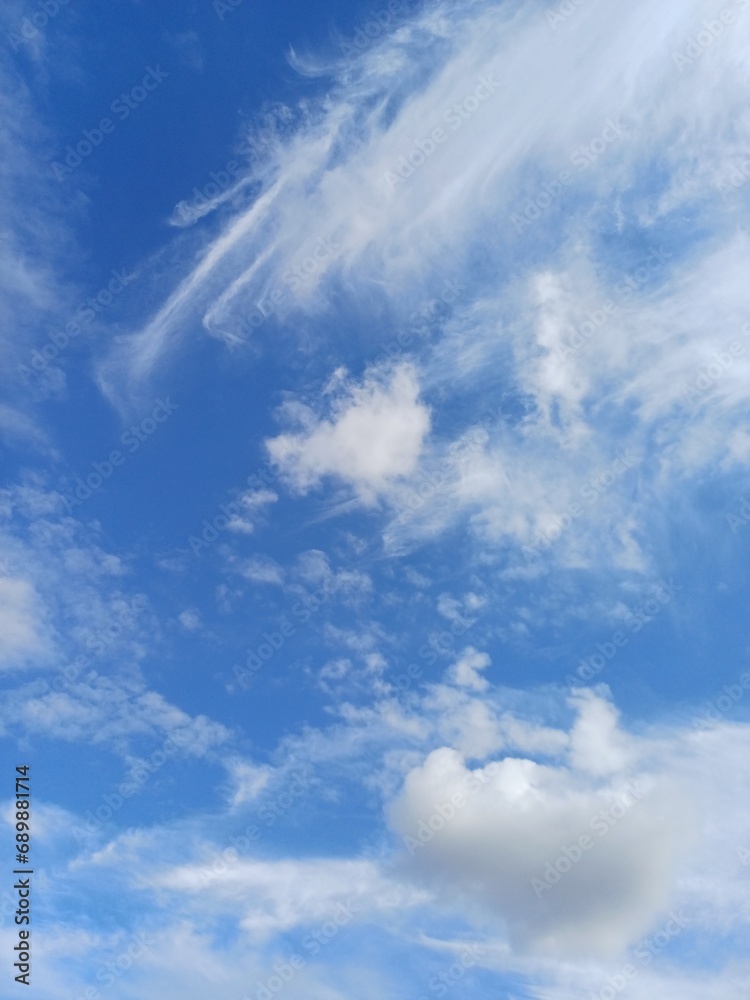 Blue sky with some like paint brush painted clouds Blue sky with some like paint brush painted clouds