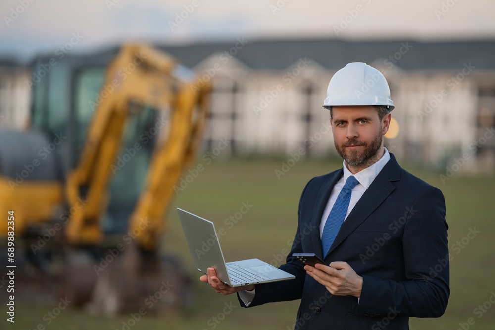 Civil engineer worker at a construction site. Engineer man in front of house background. Confident engineer worker at modern home building construction. Hispanic civil engineer in helmet. Civil engineer worker at a construction site. Engineer man in front of house background. Confident engineer worker at modern home building construction. Hispanic civil engineer in helmet.