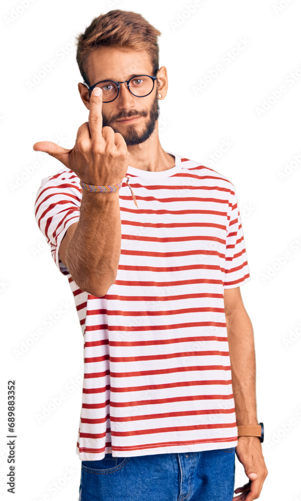 Handsome blond man with beard wearing casual clothes and glasses showing middle finger, impolite and rude fuck off expression Handsome blond man with beard wearing casual clothes and glasses showing middle finger, impolite and rude fuck off expression