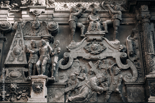 Old facade of the Boim Chapel in Lviv. Reliefs from the lives of the holy apostles and Jesus Christ on the wall of medieval architecture in Eastern Europe. photo