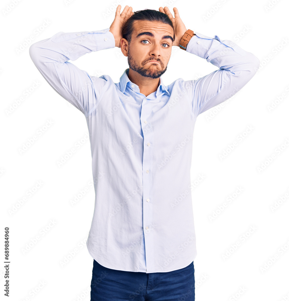 Young handsome man wearing business clothes doing bunny ears gesture with hands palms looking cynical and skeptical. easter rabbit concept.