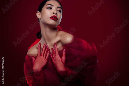 Photo of lovely asian girl femme fatale touch chest fashion lace dress shoulders off isolated dark red color background
