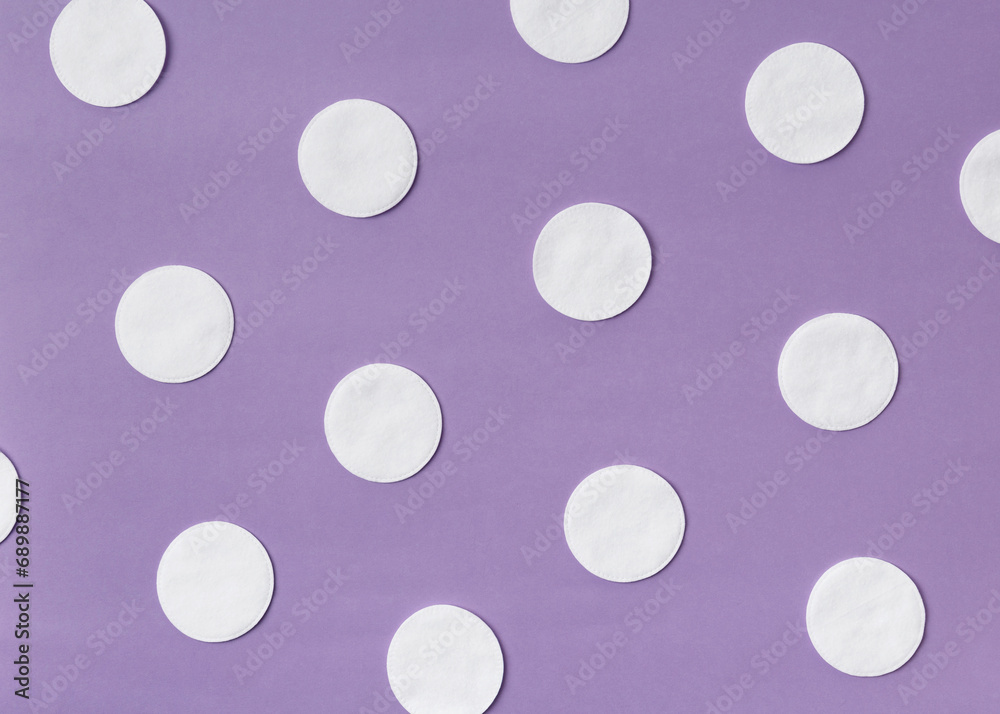 Cotton disks on a lilac background