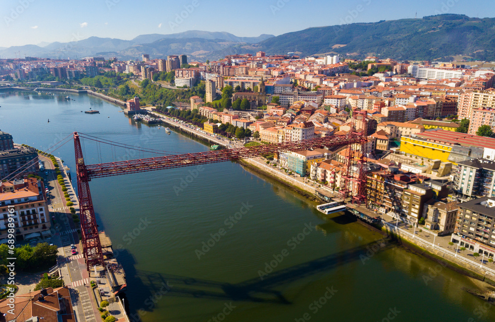 Aerial view of Vizcaya bridge over the river and cityscape at Portugalete, Spain