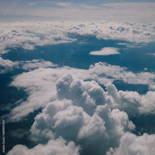Aerial view on clouds and sky from airliner plane
