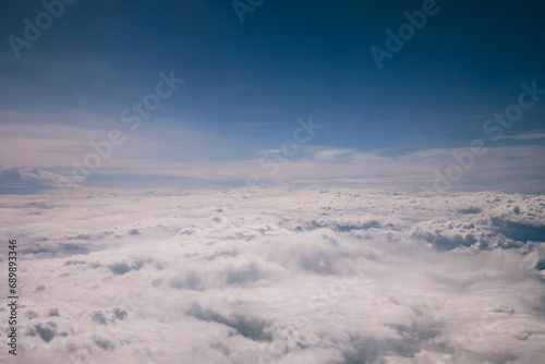Clouds over the mountains. Aerial view of sky