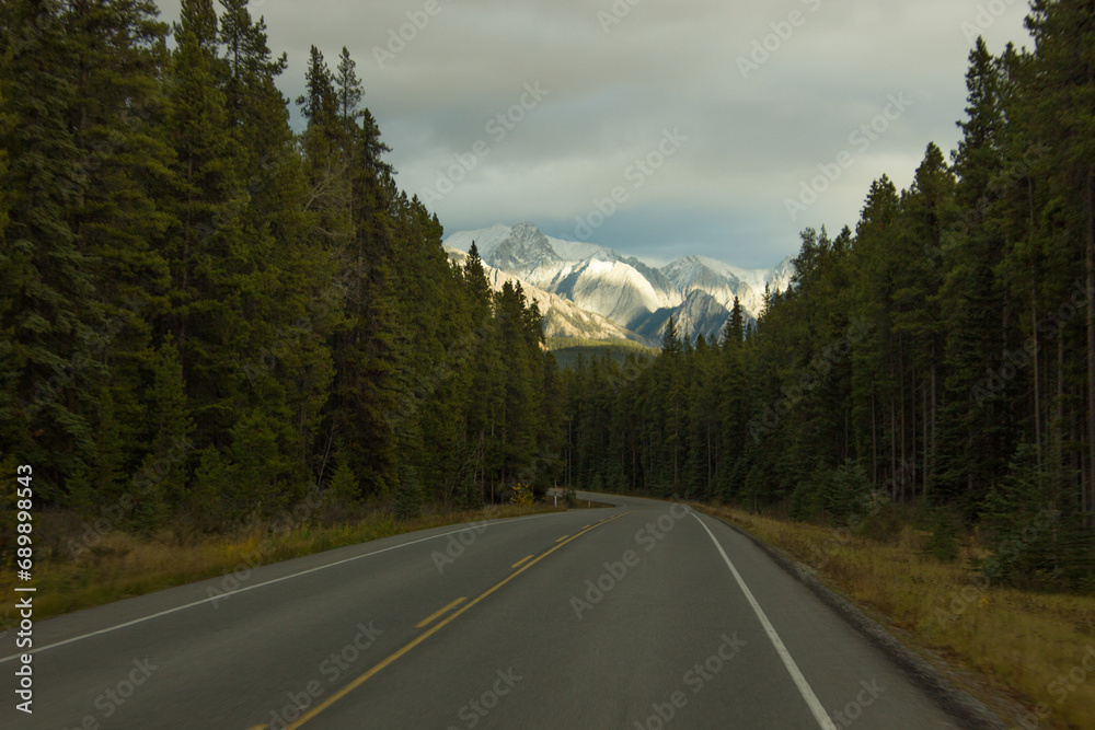 Mountain panorama illuminated by the sun, seen from a highway in Canada Mountain panorama illuminated by the sun, seen from a highway in Canada