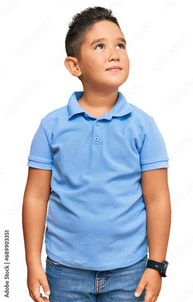 Little boy hispanic kid wearing casual clothes smiling looking to the side and staring away thinking.
