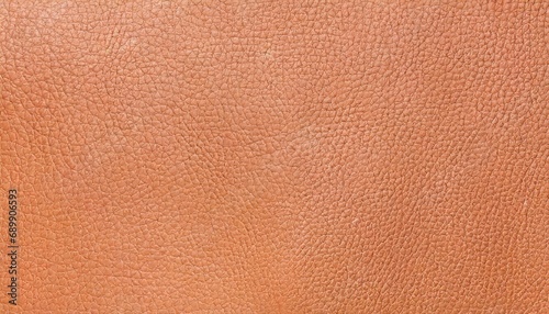 Texture of genuine leather in Peach Fuzz colors, background with selective focus and copy space © top images