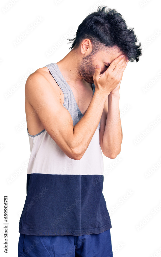 Young hispanic man wearing casual clothes with sad expression covering face with hands while crying. depression concept. Young hispanic man wearing casual clothes with sad expression covering face with hands while crying. depression concept.