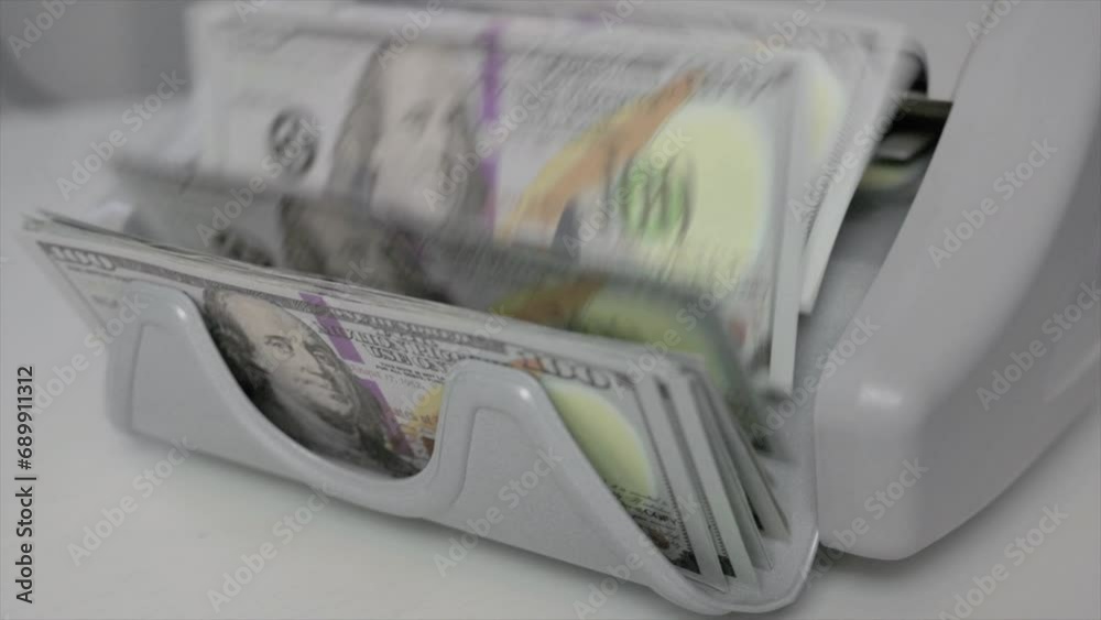 Side View of Machine Counting Money