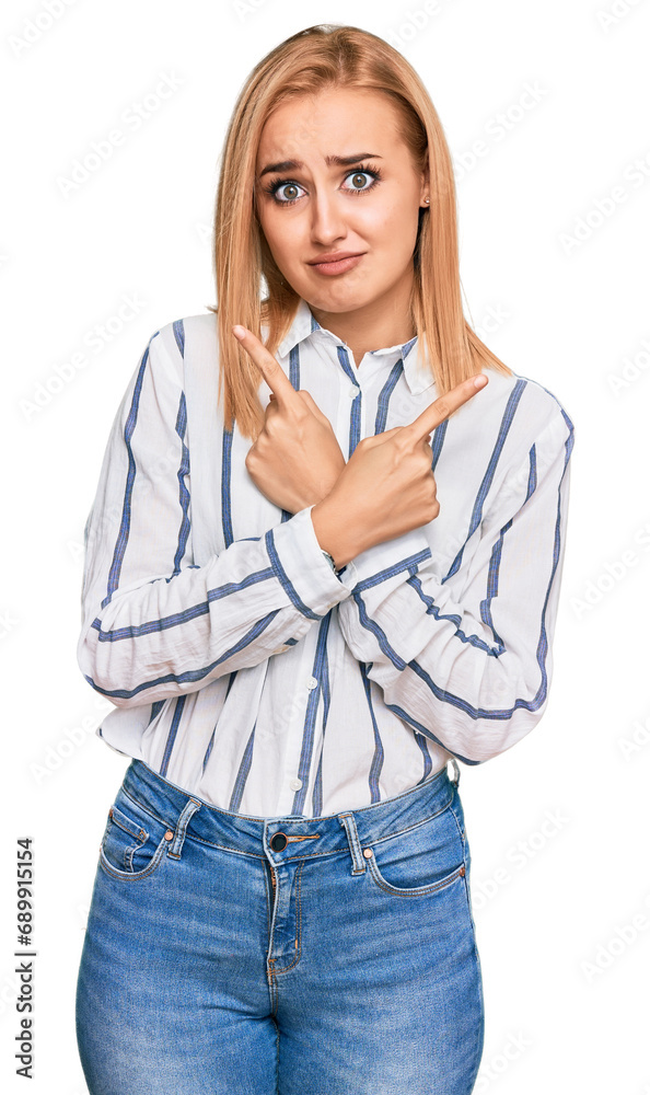 Beautiful caucasian woman wearing casual clothes pointing to both sides with fingers, different direction disagree Beautiful caucasian woman wearing casual clothes pointing to both sides with fingers, different direction disagree