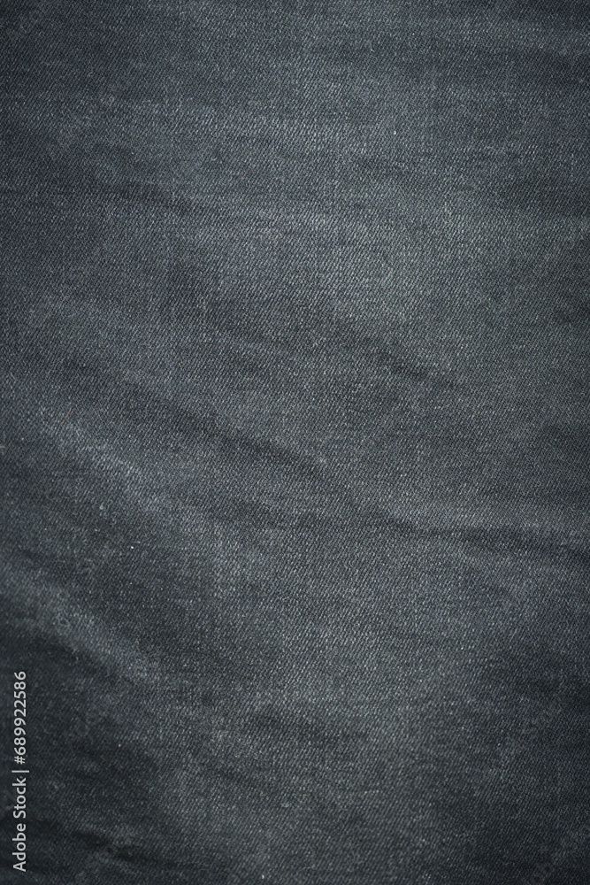 Fototapeta premium black denim clothing texture background, textile of pants fashion