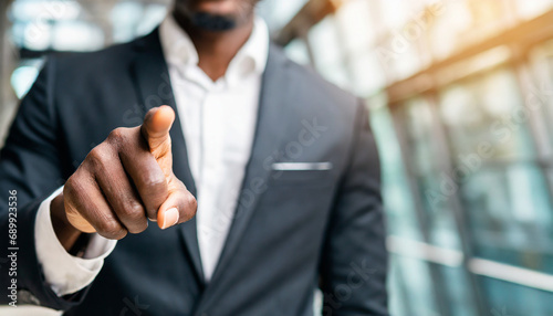 businessman pointing directly at viewer with copy space, conveying authority and direction in business communication