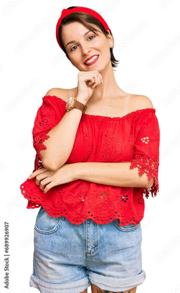 Young brunette woman with short hair wearing casual summer clothes and diadem looking confident at the camera smiling with crossed arms and hand raised on chin. thinking positive. Young brunette woman with short hair wearing casual summer clothes and diadem looking confident at the camera smiling with crossed arms and hand raised on chin. thinking positive.