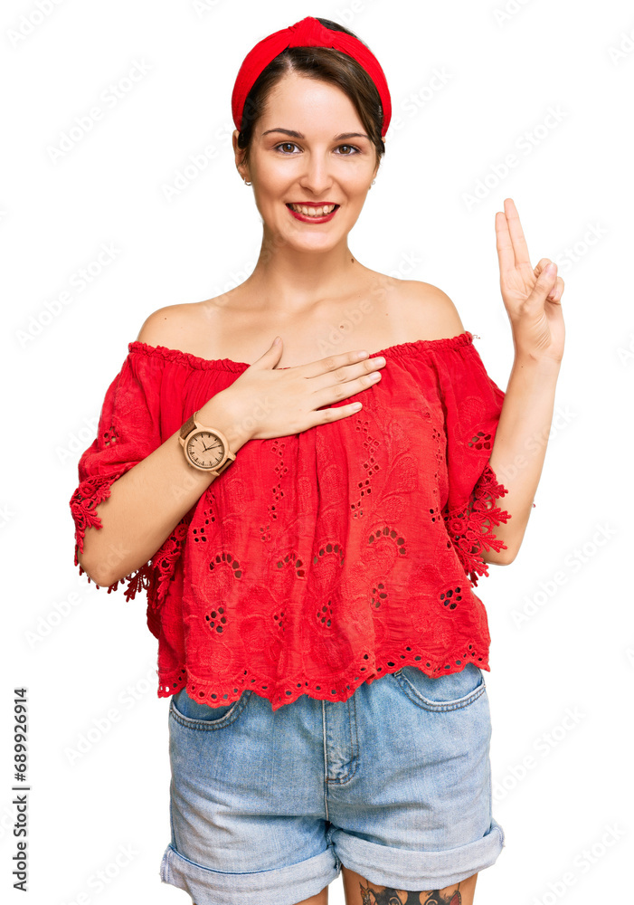 Young brunette woman with short hair wearing casual summer clothes and diadem smiling swearing with hand on chest and fingers up, making a loyalty promise oath Young brunette woman with short hair wearing casual summer clothes and diadem smiling swearing with hand on chest and fingers up, making a loyalty promise oath