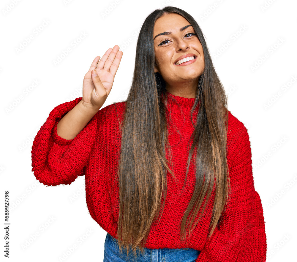 Beautiful hispanic woman wearing casual clothes waiving saying hello happy and smiling, friendly welcome gesture Beautiful hispanic woman wearing casual clothes waiving saying hello happy and smiling, friendly welcome gesture