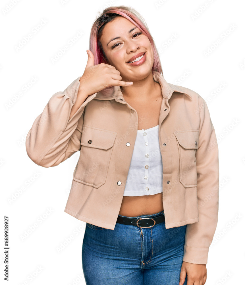 Φωτογραφία Hispanic woman with pink hair wearing casual clothes smiling doing phone gesture with hand and fingers like talking on the telephone