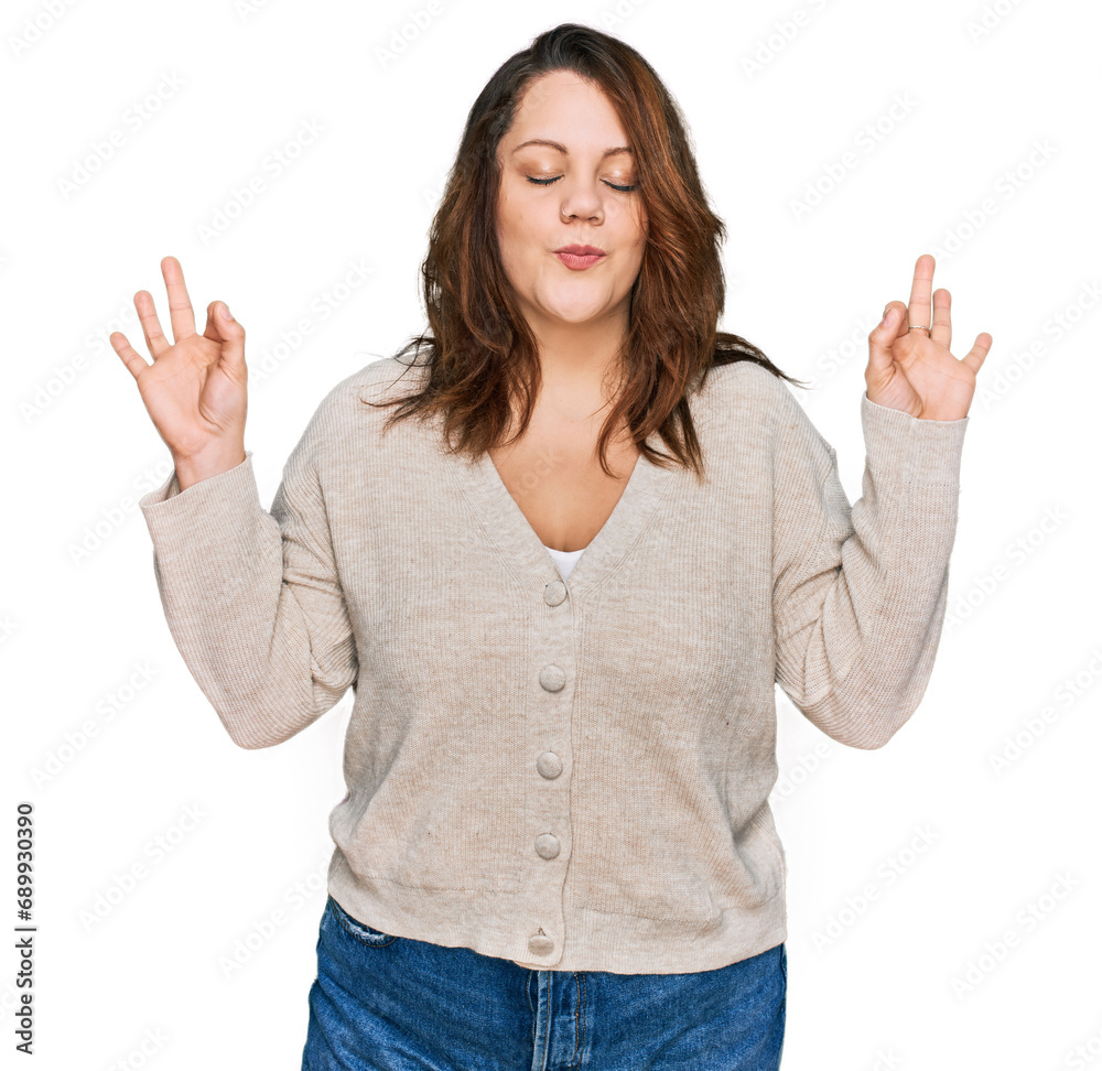 Young plus size woman wearing casual clothes relax and smiling with eyes closed doing meditation gesture with fingers. yoga concept. Young plus size woman wearing casual clothes relax and smiling with eyes closed doing meditation gesture with fingers. yoga concept.