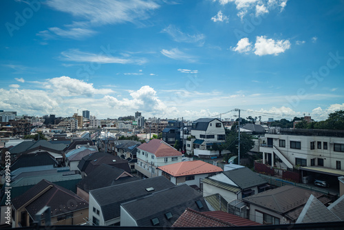 Photography Houses in the suburbs of Tokyo, Japan as seen from the Tokido Shinkansen line