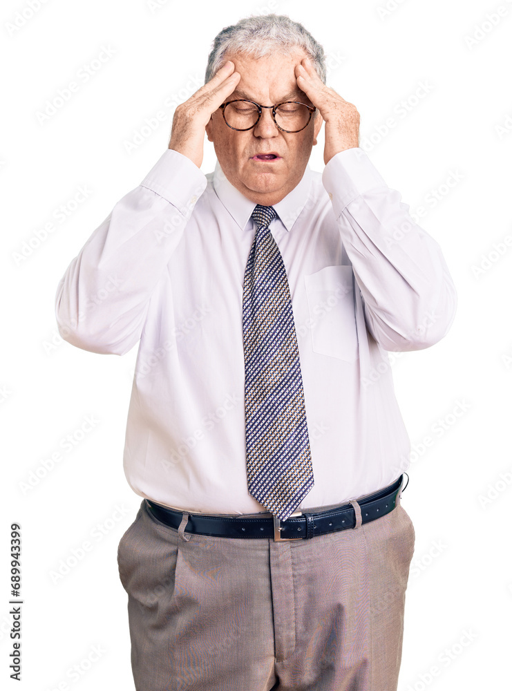 Senior grey-haired man wearing business clothes with hand on head for pain in head because stress. suffering migraine. Senior grey-haired man wearing business clothes with hand on head for pain in head because stress. suffering migraine.