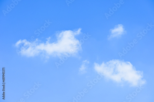 beautiful blue sky and white fluffy group of clouds with sunrise in the morning  natural background