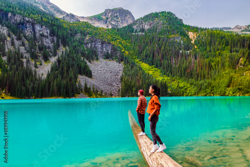 Joffre Lakes British Colombia Whistler Canada, a colorful lake of Joffre Lakes National Park in Canada. A couple of Asian women and caucasian men walking at Jofre Lake BC Canada photo