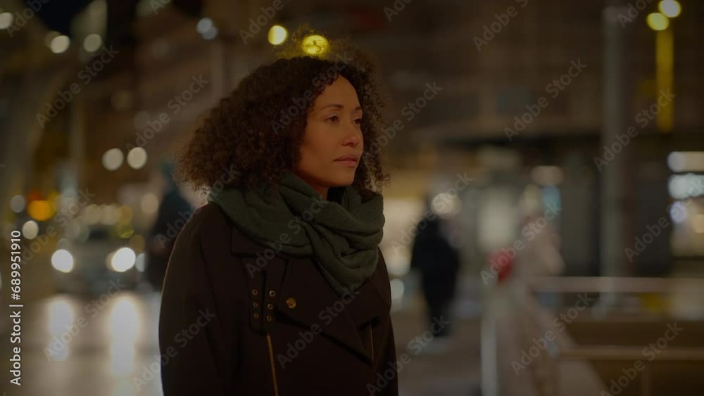 Thoughtful Woman with Braun Curly Hair Commuting in the City at Night Thoughtful Woman with Braun Curly Hair Commuting in the City at Night