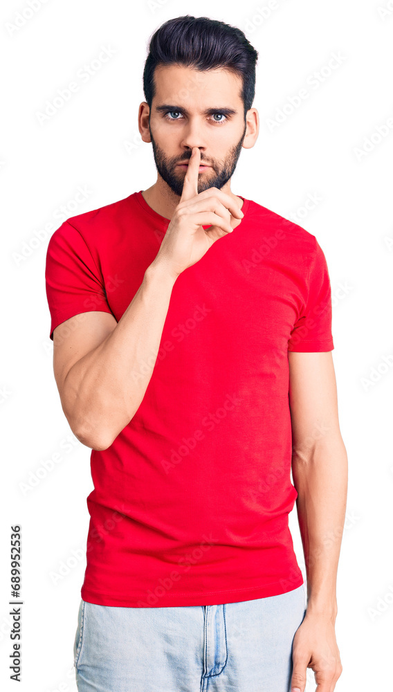 Young handsome man with beard wearing casual t-shirt asking to be quiet with finger on lips. silence and secret concept. Young handsome man with beard wearing casual t-shirt asking to be quiet with finger on lips. silence and secret concept.