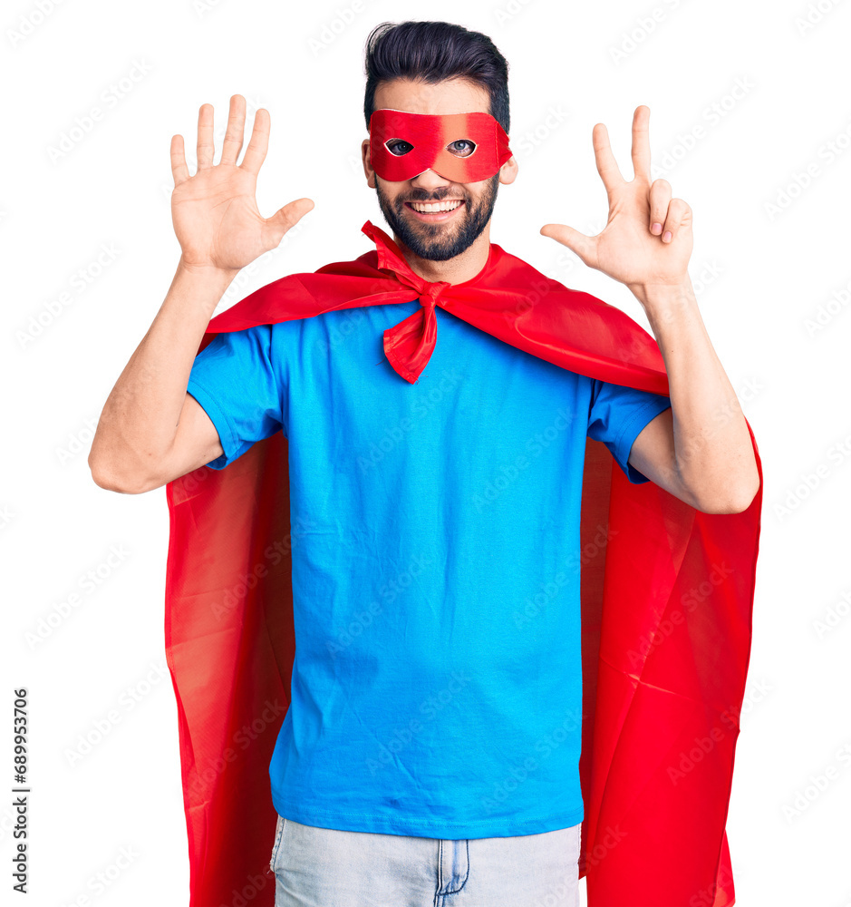 Young handsome man with beard wearing super hero costume showing and pointing up with fingers number eight while smiling confident and happy. Young handsome man with beard wearing super hero costume showing and pointing up with fingers number eight while smiling confident and happy.