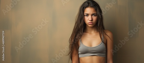 Unhappy Hispanic girl in tank top