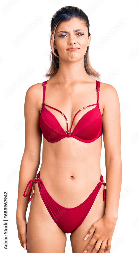 Young beautiful woman wearing bikini depressed and worry for distress, crying angry and afraid. sad expression. Young beautiful woman wearing bikini depressed and worry for distress, crying angry and afraid. sad expression.