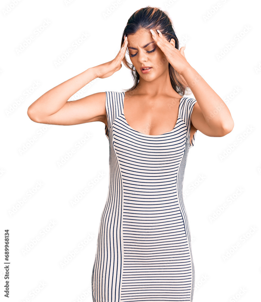 Young beautiful woman wearing casual dress suffering from headache desperate and stressed because pain and migraine. hands on head. Young beautiful woman wearing casual dress suffering from headache desperate and stressed because pain and migraine. hands on head.