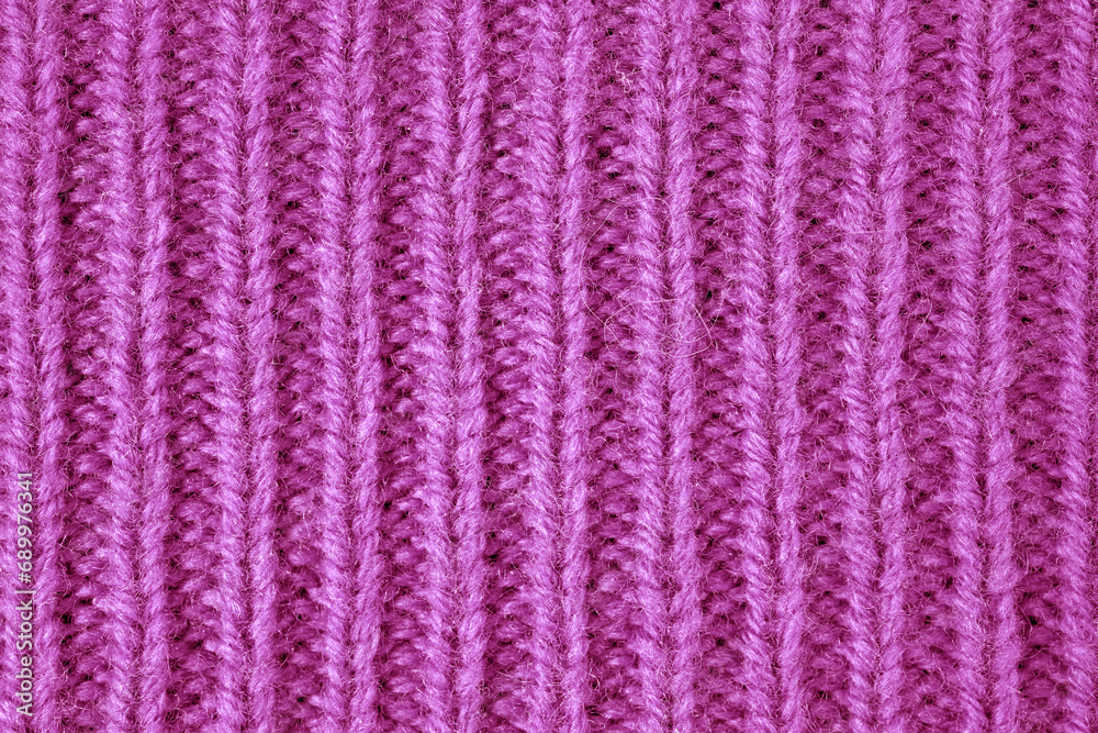 Colored large hand-knitted knitwear lies on the table. Handmade Colored large hand-knitted knitwear lies on the table. Handmade