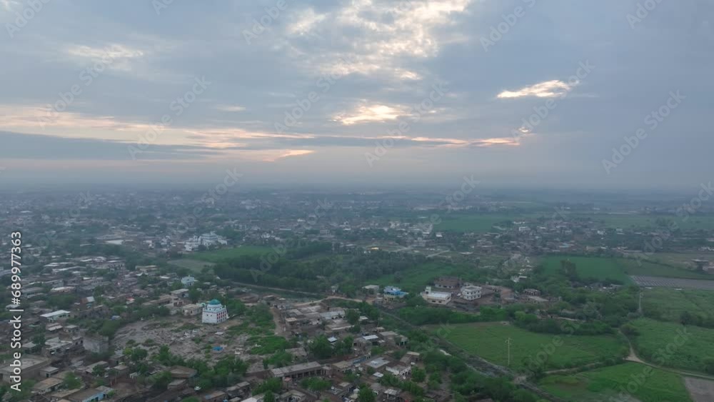 Dusk over Badin City, Sindh's lush landscape, Pakistan. Aerial Dusk over Badin City, Sindh's lush landscape, Pakistan. Aerial
