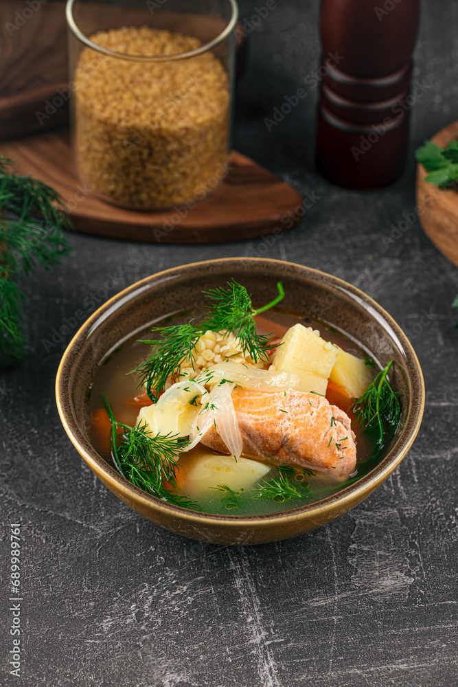 Bowl of appetizing salmon soup with vegetables Bowl of appetizing salmon soup with vegetables