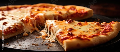 Selective focus on an Italian pizza with melted cheese. photo