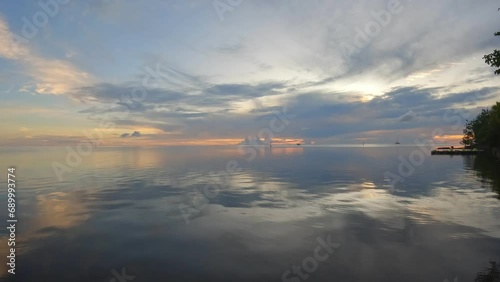 Beach View at Sunset in Tahiti, French Polynesia ~ Slow Pan of the Pacific Ocean from Paea photo