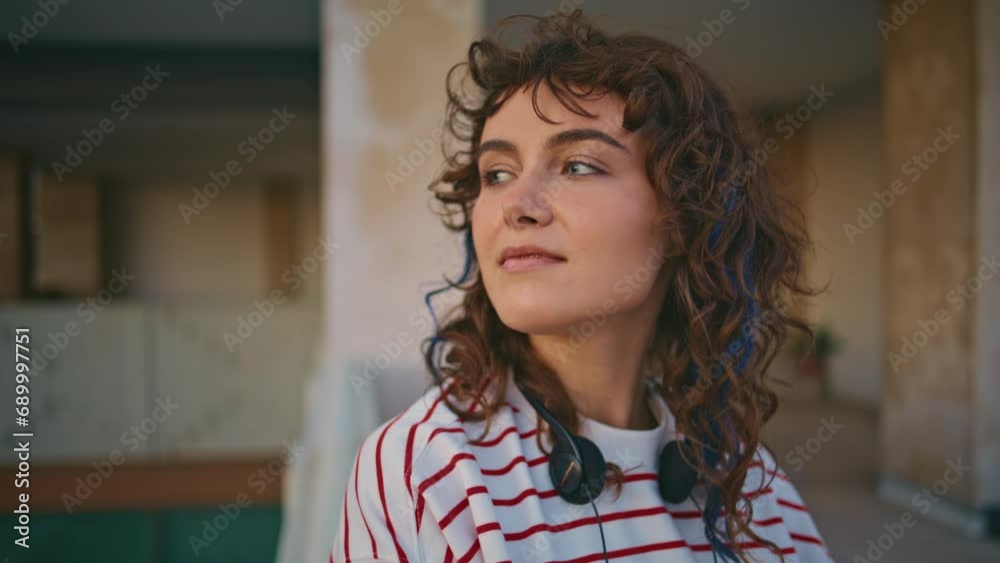 Relaxed woman posing outdoors enjoying evening street alone closeup portrait Relaxed woman posing outdoors enjoying evening street alone closeup portrait