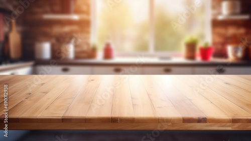Empty wooden table and blurred kitchen interior background, product display montage © tashechka