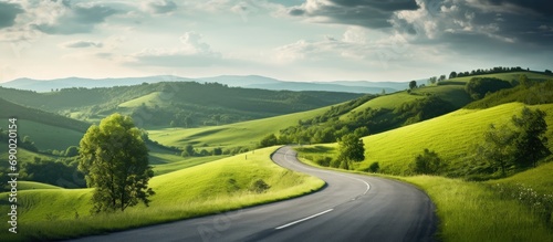 Picturesque road through hilly countryside. photo