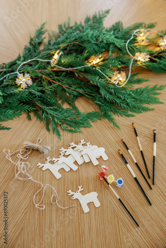 Handmade reindeer ornaments on festive craft table