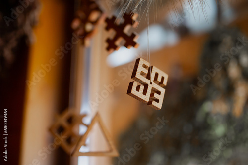 Wooden cut Latvian national pagan symbols cut in wood. National legacy pagan forms