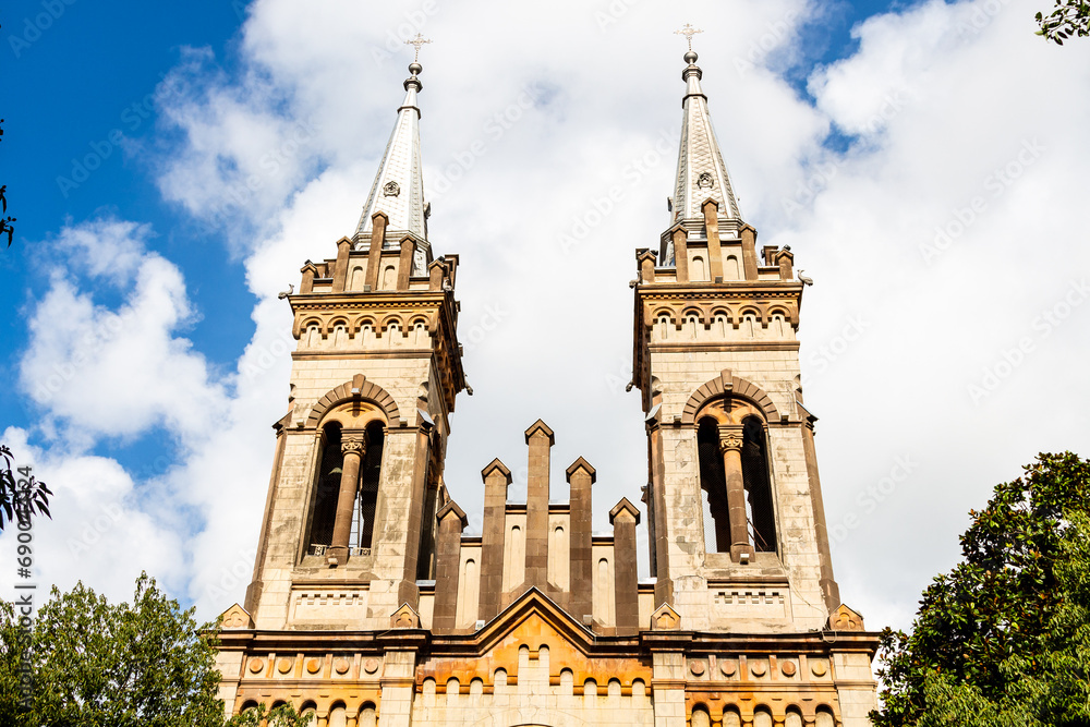 Fototapeta premium travel to Georgia - front view of towers of Batumi Cathedral of the Mother of God in Batumi city on sunny autumn day