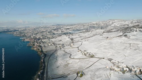 Lavaux Vineyard And Hillside Village On The Shore Of Lake Geneva During Winter In Switzerland. - aerial shot